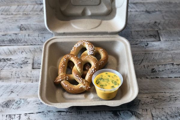 Land O'Lakes Foodservice Bacon Scallion Queso Dip with Pretzel in to-go container