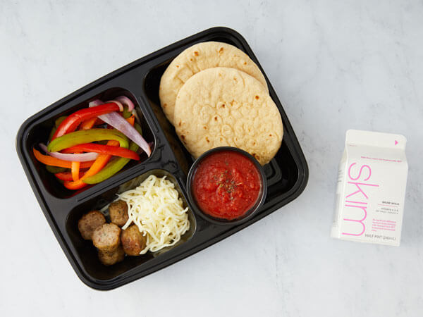 ALT TEXT: Land O’Lakes Foodservice | Mini Meatball Pizza Kit with mini turkey meatballs, mini flatbread rounds, marinara sauce dip cup, Land O Lakes® Shredded Mozzarella Cheese and bell pepper and onion blend