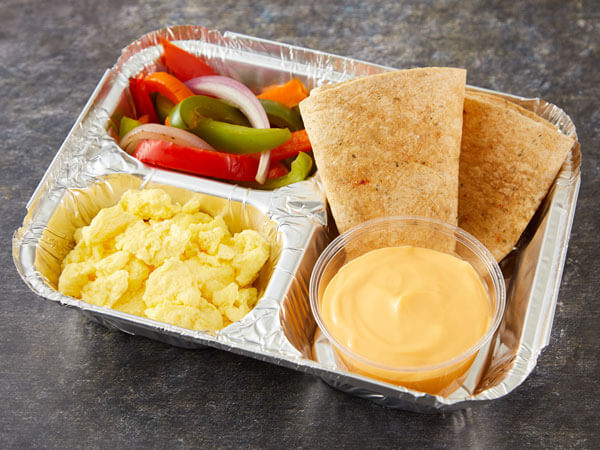 ALT TEXT: Land O’Lakes Foodservice | Breakfast Burrito Kit with Land O Lakes® Ultimate Cheddar™ Cheese Sauce, scrambled eggs, bell pepper and onion blend and whole grain tortillas